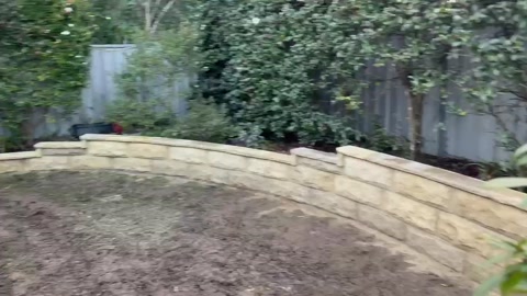 Curved sandstone retaining wall