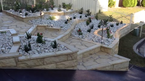 Sandstone block job with water feature & central stairs